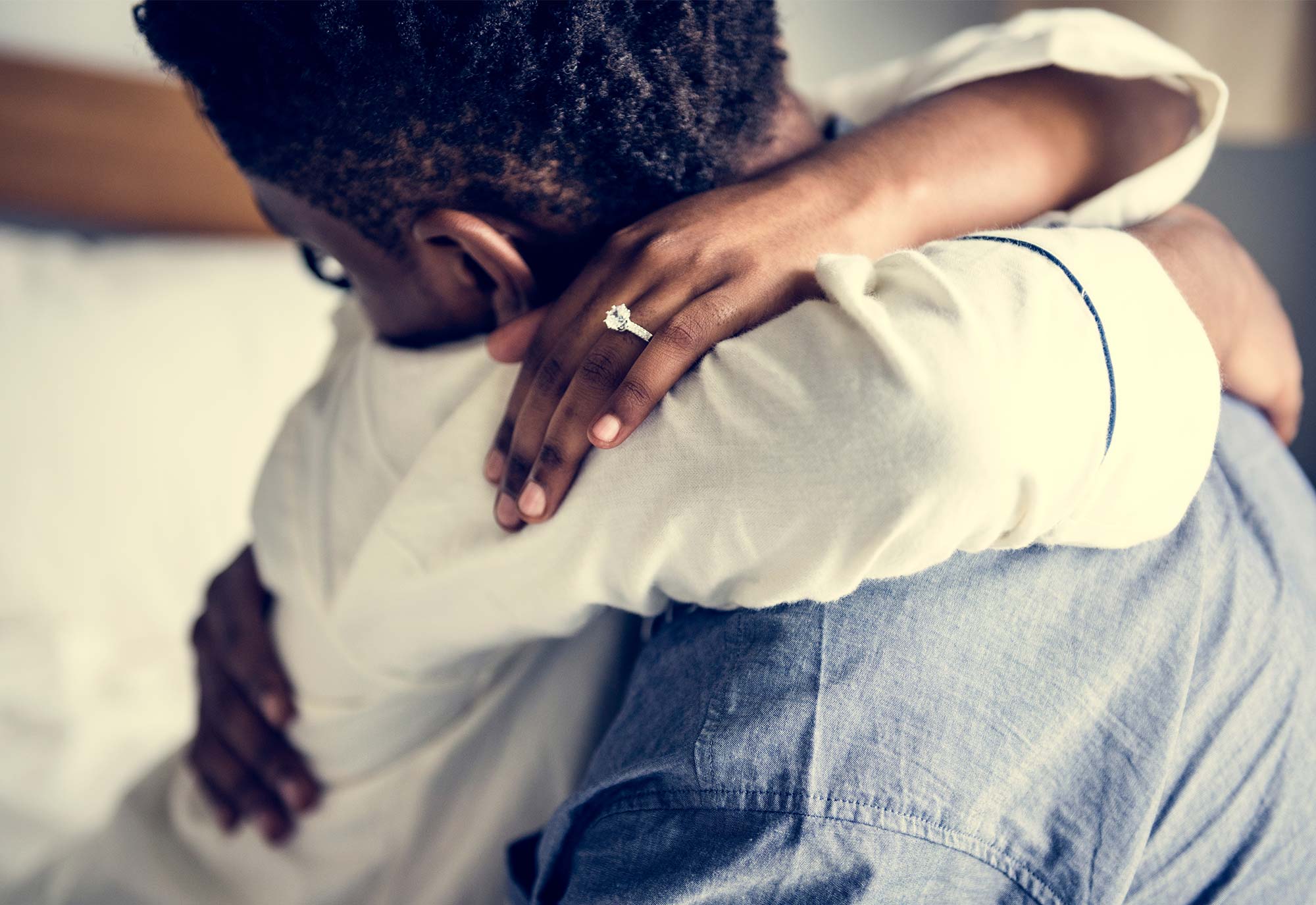 couple hugging to celebrate engagement