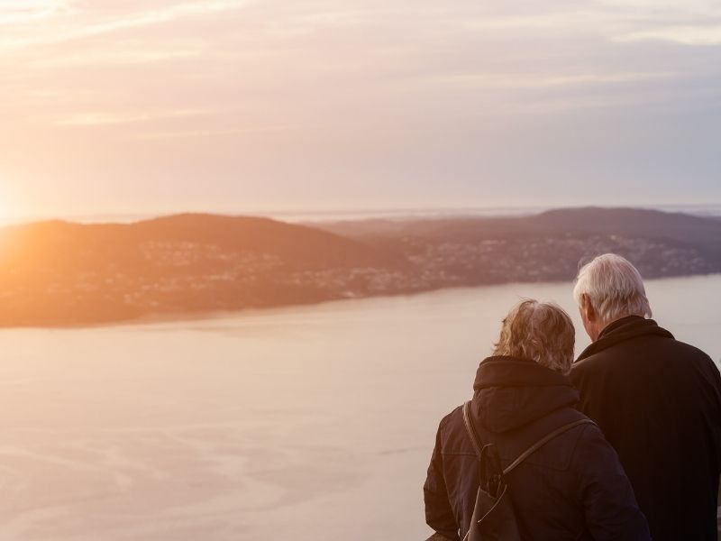 Elderly couple looking at the sunset