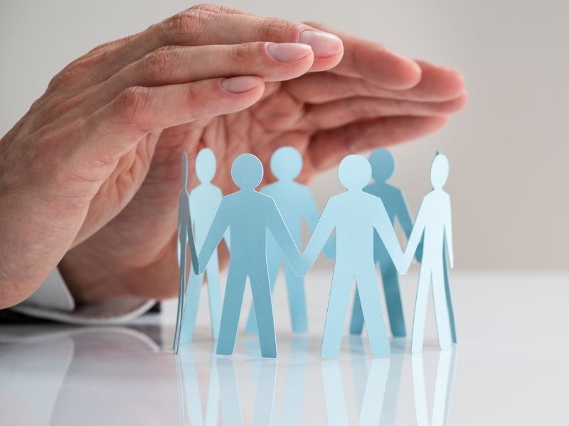 Hands protecting family or employees